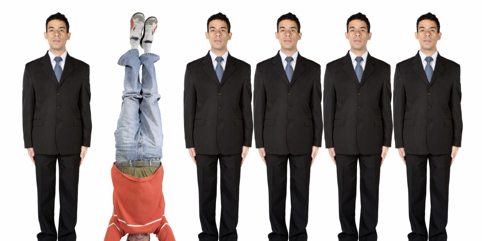 business people in a series with a casual guy doing the headstand